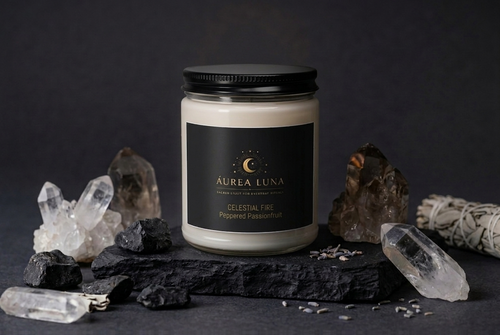Celestial Fire ritual soy candle with crystals and smudge stick on dark slate — Áurea Luna