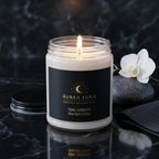 Tidal Harmony candle burning beside water stones in a meditation setting — Áurea Luna
